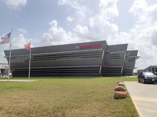 Mammoet building with US and Canadian flags in front of it